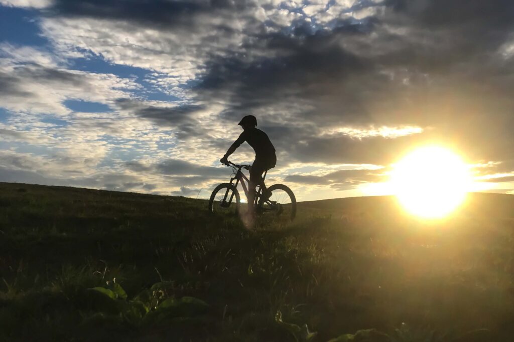Someone riding a bike, which one of the many Things To Do In Taos New Mexico.